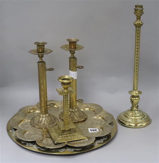 A pair of 19th century brass candlesticks, another and a table lamp base and two trays